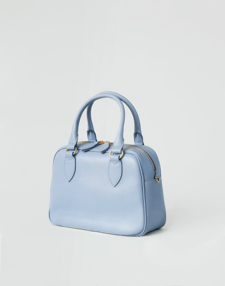 hyer goods la corsa pale blue leather bowling bag 3/4 view #color_pale-blue