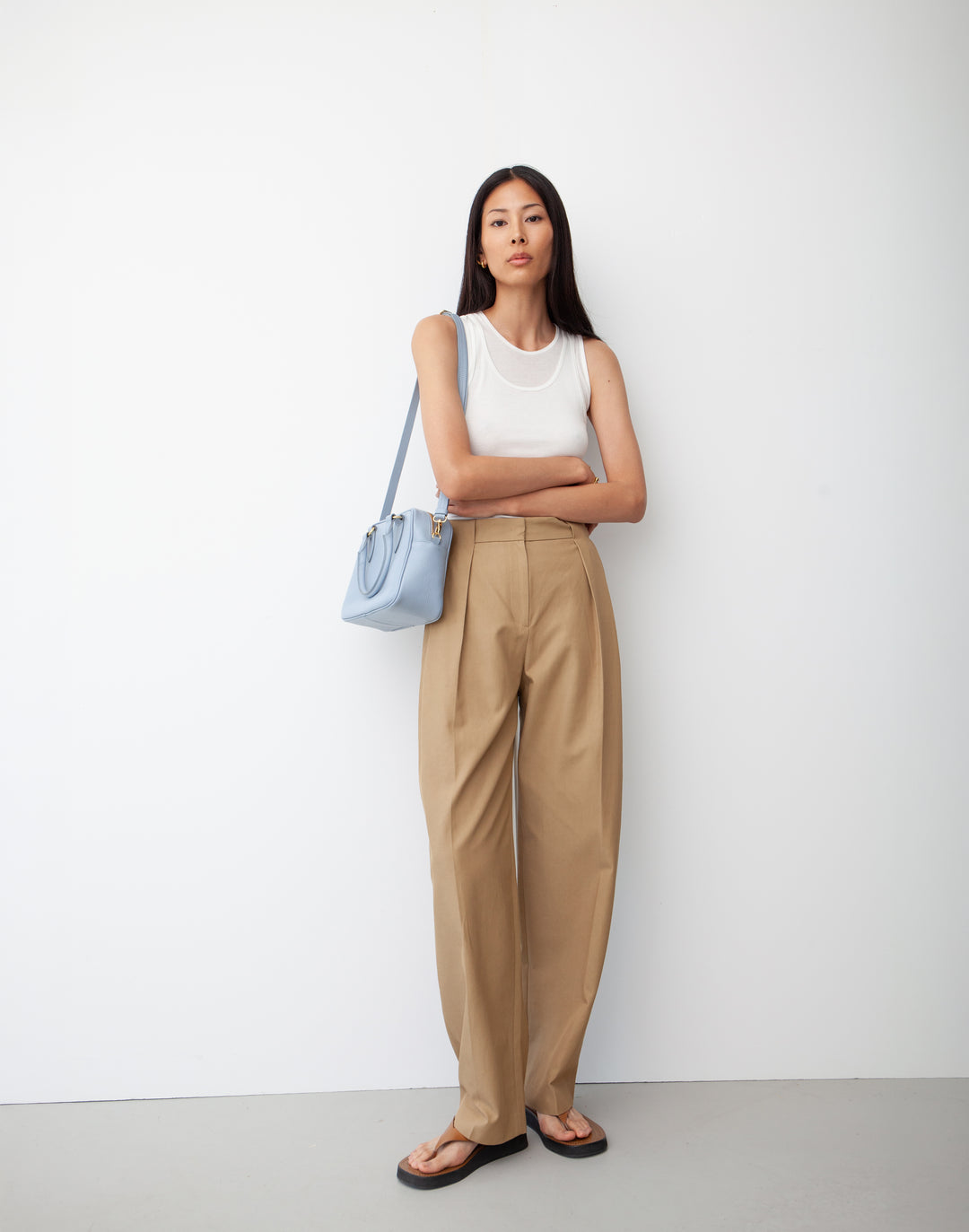 hyer goods la corsa pale blue leather bowling bag worn as a shoulder bag #color_pale-blue