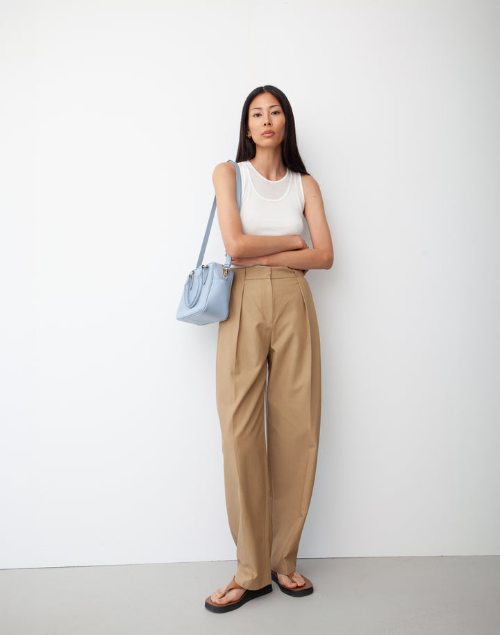 hyer goods la corsa pale blue leather bowling bag worn as a shoulder bag #color_pale-blue