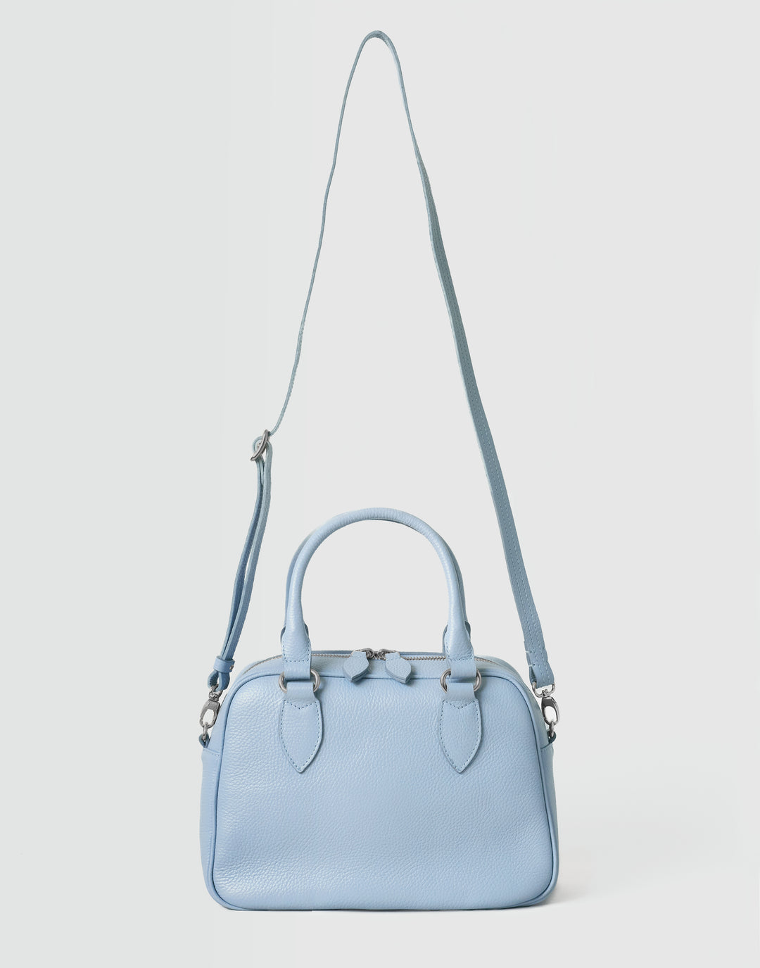 hyer goods la corsa pale blue leather bowling bag front view with crossbody strap pale blue with silver hardware #color_pale-blue