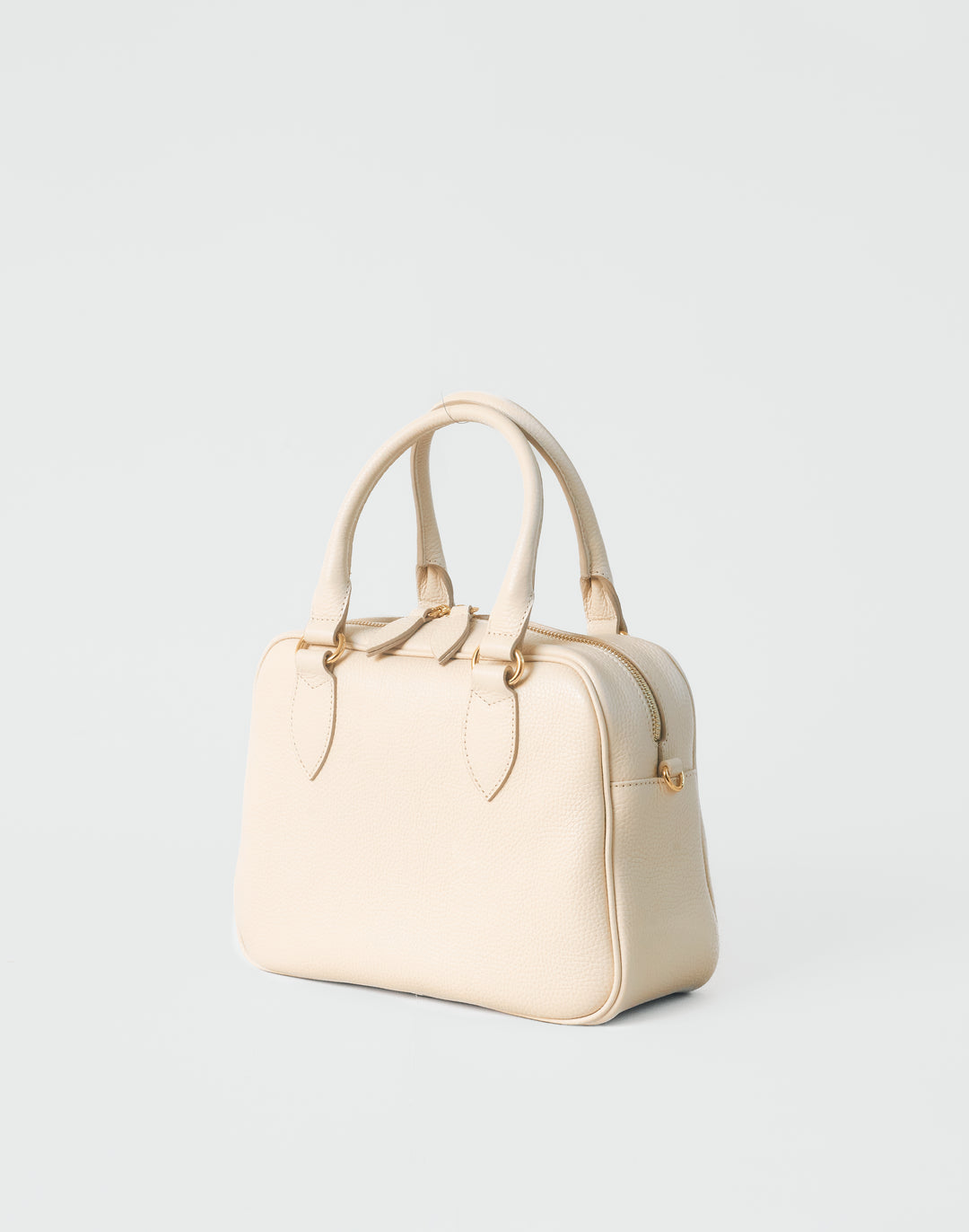 hyer goods la corsa off-white leather bowling bag 3/4 view bone with gold hardware #color_bone