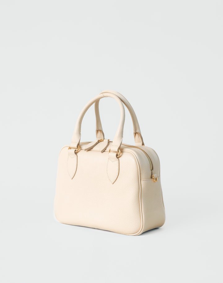hyer goods la corsa off-white leather bowling bag 3/4 view bone with gold hardware #color_bone