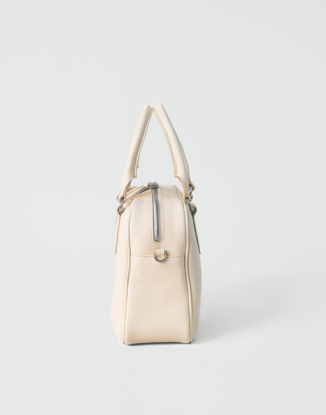 hyer goods la corsa off-white leather bowling bag side view bone with silver hardware #color_bone 