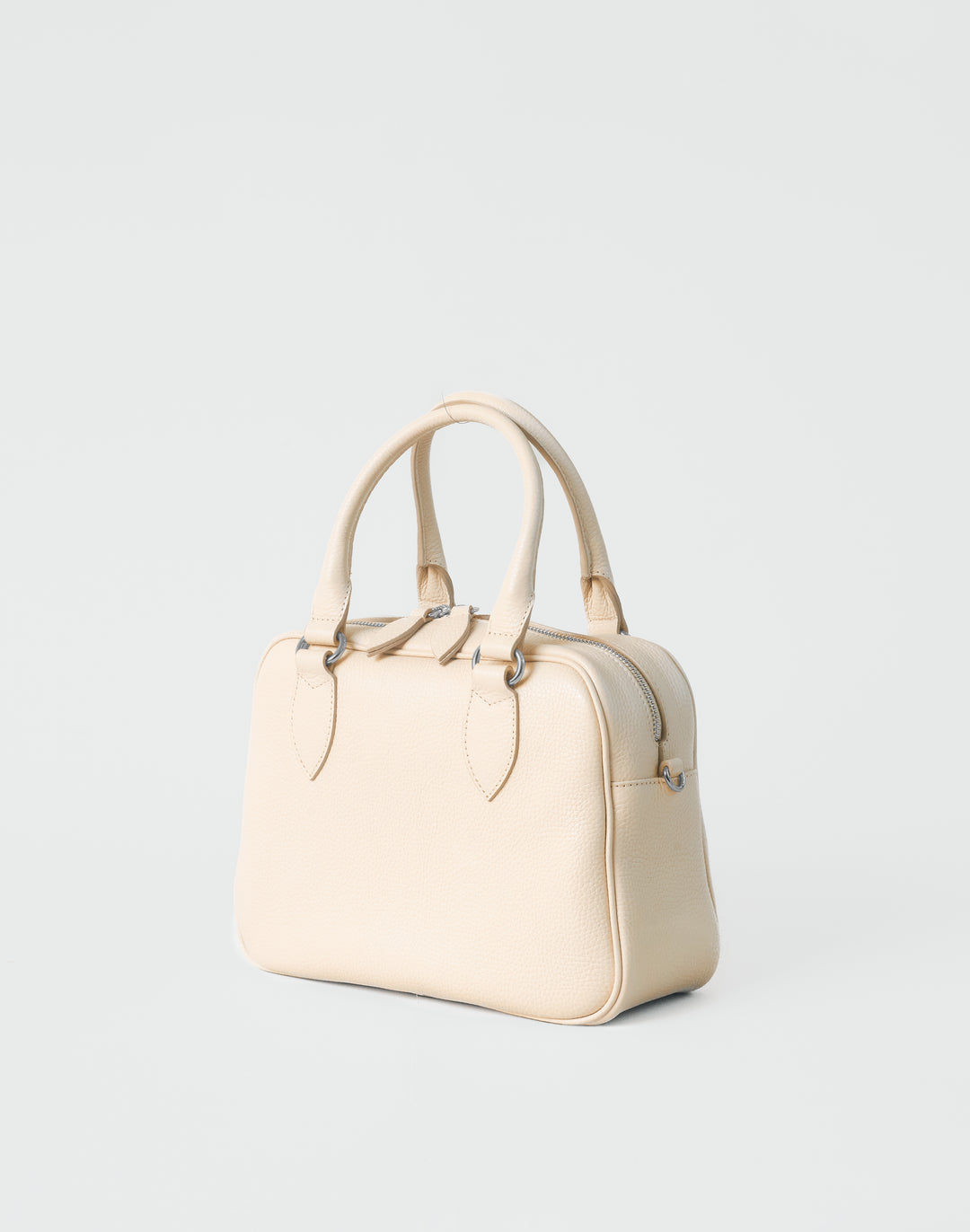 hyer goods la corsa off-white leather bowling bag 3/4 view bone with silver hardware #color_bone 