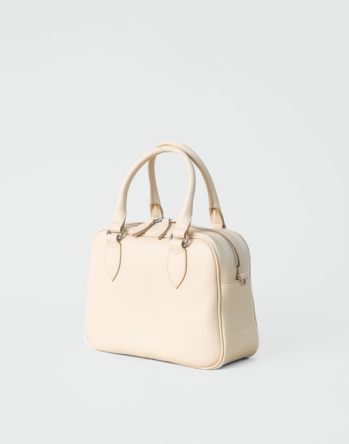 hyer goods la corsa off-white leather bowling bag 3/4 view bone with silver hardware #color_bone 