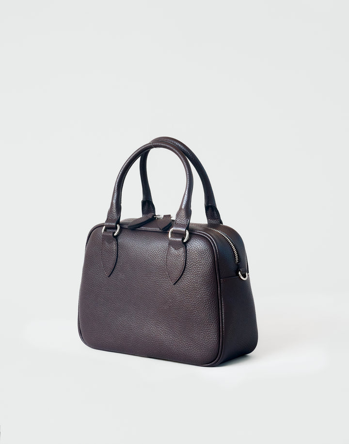 hyer goods la corsa dark brown leather bowling bag 3/4 view dark chocolate with silver hardware #color_dark-chocolate