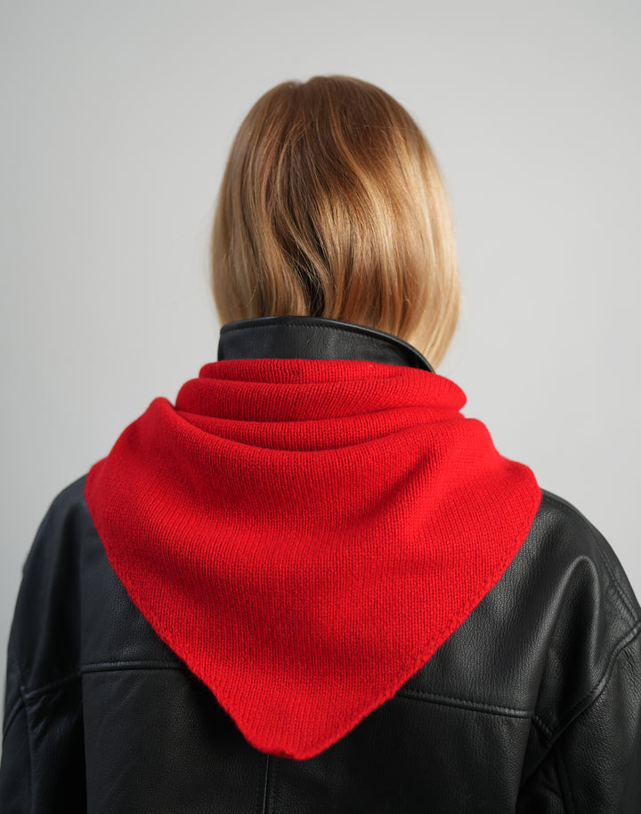 back view of a HYER GOODS red wool cashmere triangle bandana scarf knit from Italian luxury yarn tied around the neck #color_red