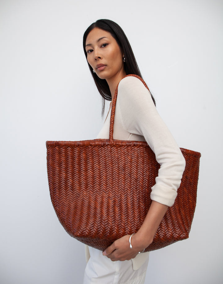 hyer goods tan woven leather oversized mercato summer tote bag on the shoulder #color_tan