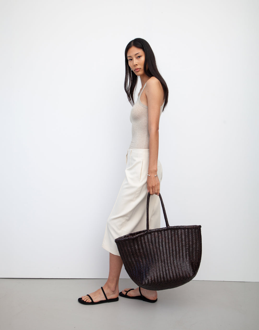 hyer goods tan woven leather oversized mercato summer tote bag by the side #color_dark-chocolate