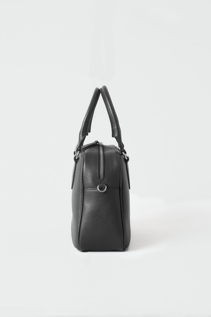 hyer goods la corsa black leather bowling bag side view black with silver hardware #color_black