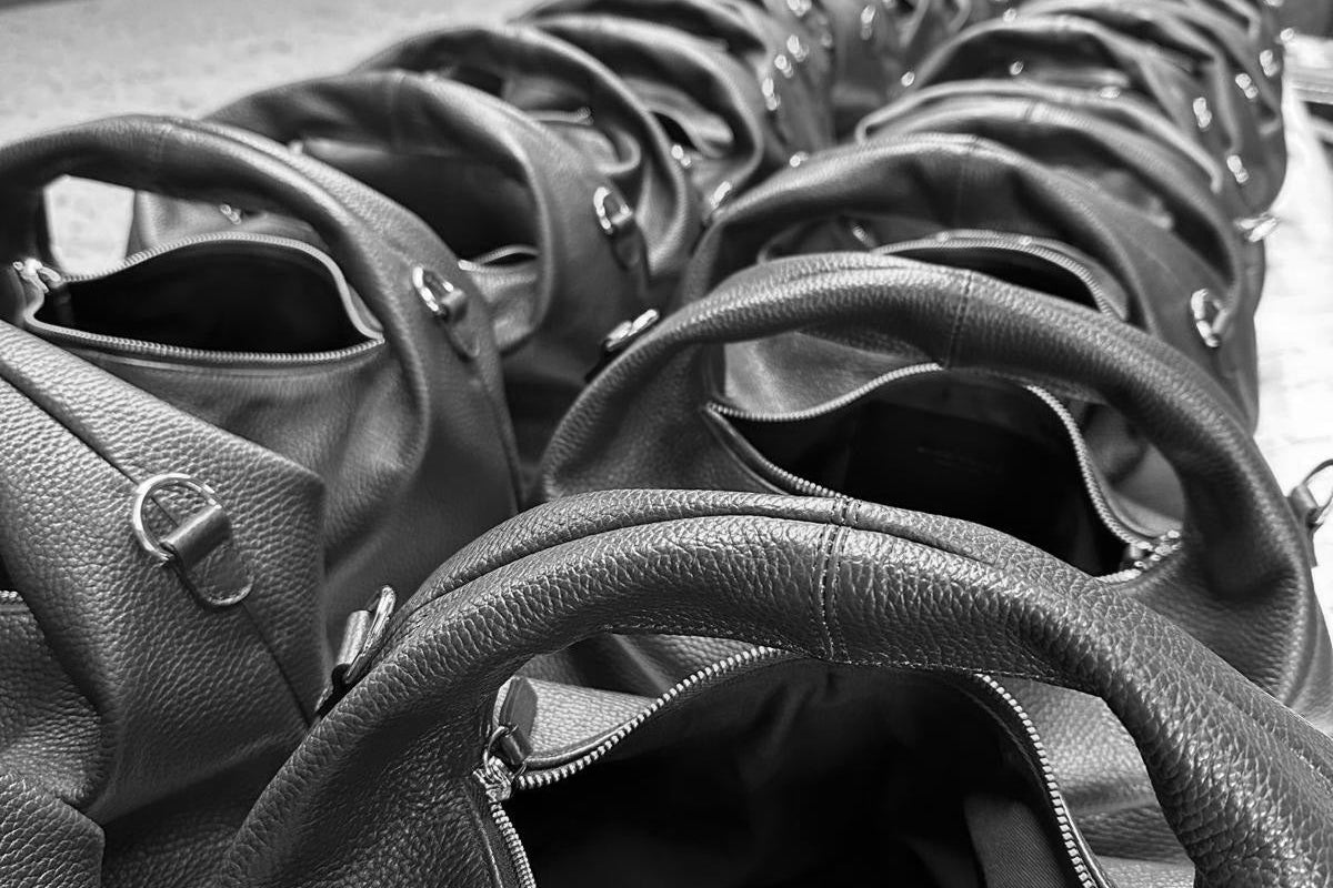 Italian tumbled leather handbags in the final stages of production.